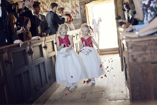 Flower girls walking down the aisle- wedding photo by top Swedish
